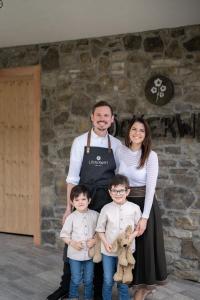 a man and a woman and two children posing for a picture at Löckerwirt in Sankt Margarethen im Lungau