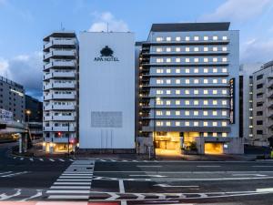 a building with an amazon sign on the side of it at APA Hotel Kyoto Eki Horikawadori in Kyoto