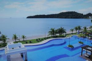 a view of the beach from a resort with a swimming pool at 07F Resort Breathtaking Ocean Views Panama Canal in ArraijÃ¡n