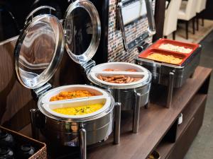a buffet line with many different types of food at APA Hotel Kyoto Eki Horikawadori in Kyoto