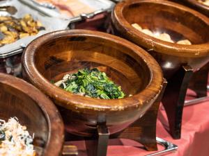 a group of wooden bowls of food on a table at APA Hotel Kyoto Eki Horikawadori in Kyoto