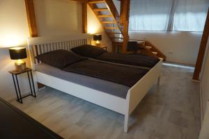 Ένα ή περισσότερα κρεβάτια σε δωμάτιο στο Die ganz besondere Ferienwohnung