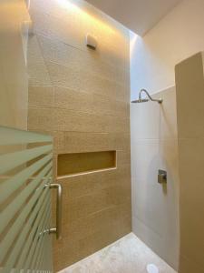 a shower with a glass door in a bathroom at Casa Mon Repos en Careyes in Careyes