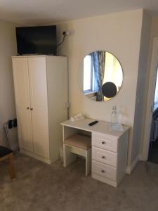 Televiisor ja/või meelelahutuskeskus majutusasutuses Harbour View Accommodation
