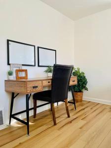 a desk with a chair in a room at Heavensville Haven - One bedroom apartments in Evansville