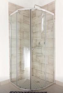 a shower with a glass enclosure in a bathroom at Cradock Guest House in Cradock