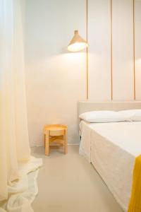Postel nebo postele na pokoji v ubytování Hostal Mamà Mambò - Zona Colonial