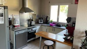 a kitchen with a sink and a counter top at Chez Ced&Lolo in Béziers