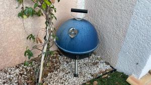 a blue water container sitting next to a wall at Chez Ced&Lolo in Béziers +1 photo