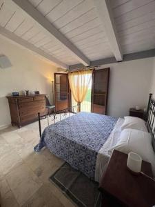 a bedroom with a large bed and a wooden dresser at Casa Linda in Siena