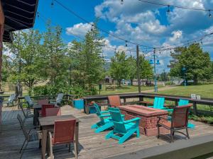 a deck with tables and chairs and a picnic table at Endion Inn in Duluth