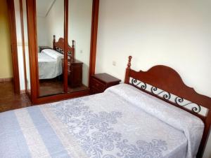 En eller flere senge i et værelse på Urbanizacion Corconera