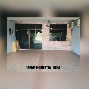 an empty building with a sign that reads dream homesiny life at Homestay Jitra Dream Homestay in Jitra