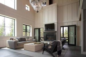 a living room with a couch and a fireplace at NEW Rustic Modern Cabin at Lutsen Mountains in Lutsen