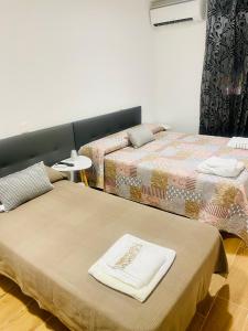 Postel nebo postele na pokoji v ubytování Hostal La Taberna