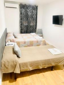 Postel nebo postele na pokoji v ubytování Hostal La Taberna