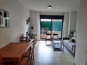 a living room with a couch and a table at Apartamento en Torre del Mar in Torre del Mar