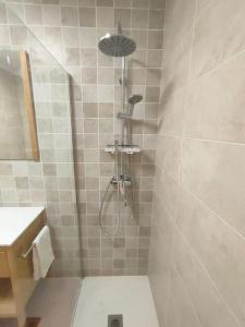 a bathroom with a shower with a toilet and a sink at Ventana al Albarracin in Benamahoma