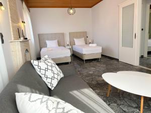 Postel nebo postele na pokoji v ubytování Magdalini House