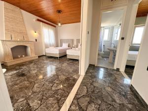 Postel nebo postele na pokoji v ubytování Magdalini House