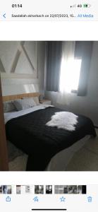 una imagen de un dormitorio con cama y ventana en Hassan Rabat, en Rabat