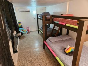 a room with two bunk beds and a small room with a room at Whole House by Beach - Relaxing & Family Friendly! 