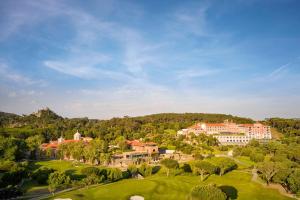 an aerial view of a resort with trees and buildings at Penha Longa Resort in Sintra