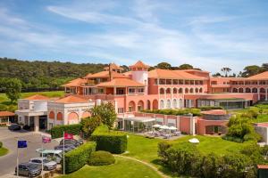 an aerial view of a large pink building at Penha Longa Resort in Sintra