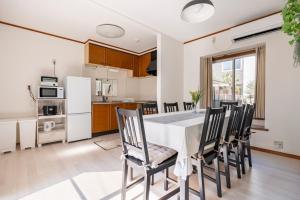 a kitchen and dining room with a table and chairs at BISK PARK TOKYO - 4LDK Spacious House - Easy Access to Asakusa, Skytree area & Airport in Tokyo