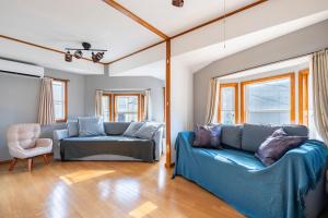 a living room with two blue couches and a chair at BISK PARK TOKYO - 4LDK Spacious House - Easy Access to Asakusa, Skytree area & Airport in Tokyo