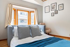 a bedroom with a bed and a window and a chair at BISK PARK TOKYO - 4LDK Spacious House - Easy Access to Asakusa, Skytree area & Airport in Tokyo