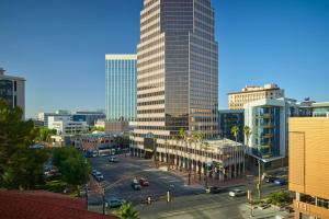 a city with tall buildings and a street with cars at The Leo Kent Hotel, Tucson, a Tribute Portfolio Hotel in Tucson