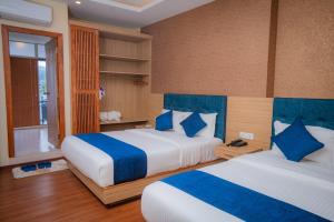 Majestic Lake Front Hotel & Suites 객실 침대