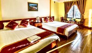Postel nebo postele na pokoji v ubytování Cherry Hotel