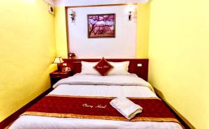 Postel nebo postele na pokoji v ubytování Cherry Hotel