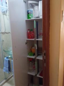 a shelf in a bathroom with some items on it at Paiva in Lima
