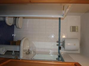 a bathroom with a bath tub with a sink at Quinta holiday residence in Rio nell'Elba in Rio nellʼElba +24 photos