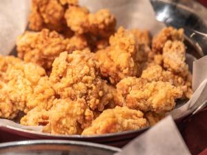 a bowl of fried food sitting on a table at APA Hotel Kyoto Eki Horikawadori in Kyoto