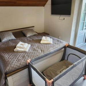 מיטה או מיטות בחדר ב-Apartmán Pure Harmony