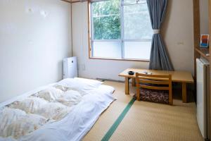熊野の宿海ひかり　別館 객실 침대