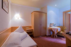 Posteľ alebo postele v izbe v ubytovaní Hotel Garni Martina
