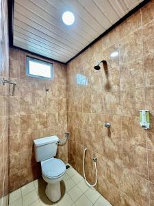 a bathroom with a toilet and a shower at Kangar Hotel Sdn Bhd in Kangar