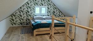 Tempat tidur dalam kamar di Smerekowa Ostoja