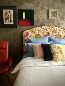 a bedroom with a bed with pillows on it at Olga apartment in Riga