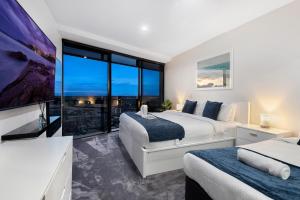 Ένα ή περισσότερα κρεβάτια σε δωμάτιο στο Circle on Cavill Surfers Paradise- 2 Bedroom Sky Home +13 φωτογραφίες