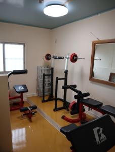 a gym with several exercise equipment in a room at Pension Alba - Vacation STAY 70925v in Tateyama