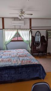 a bedroom with a bed and a window at Pension Alba - Vacation STAY 70925v in Tateyama