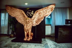 a golden angel statue in a room at Vannasut Hotel and Spa in Kathmandu