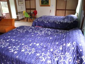A bed or beds in a room at Pension Alba - Vacation STAY 70972v
