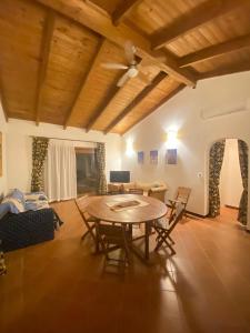 a living room with a table and a couch at Casa Ethno Stintino-Private pool in Stintino